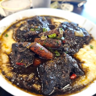 Jerk Oxtails & Grits